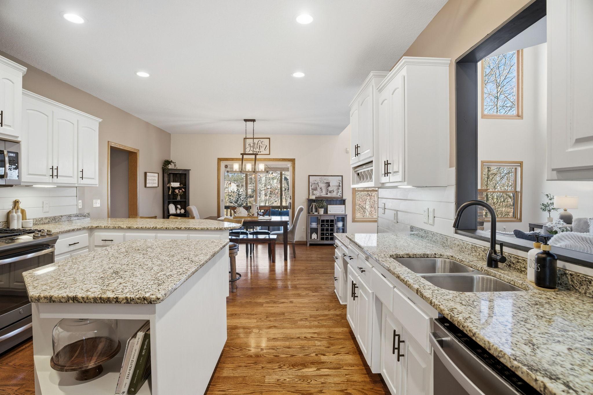 From the kitchen sink, enjoy a peek through opening into the great room, maintaining a sense of openness and connection.