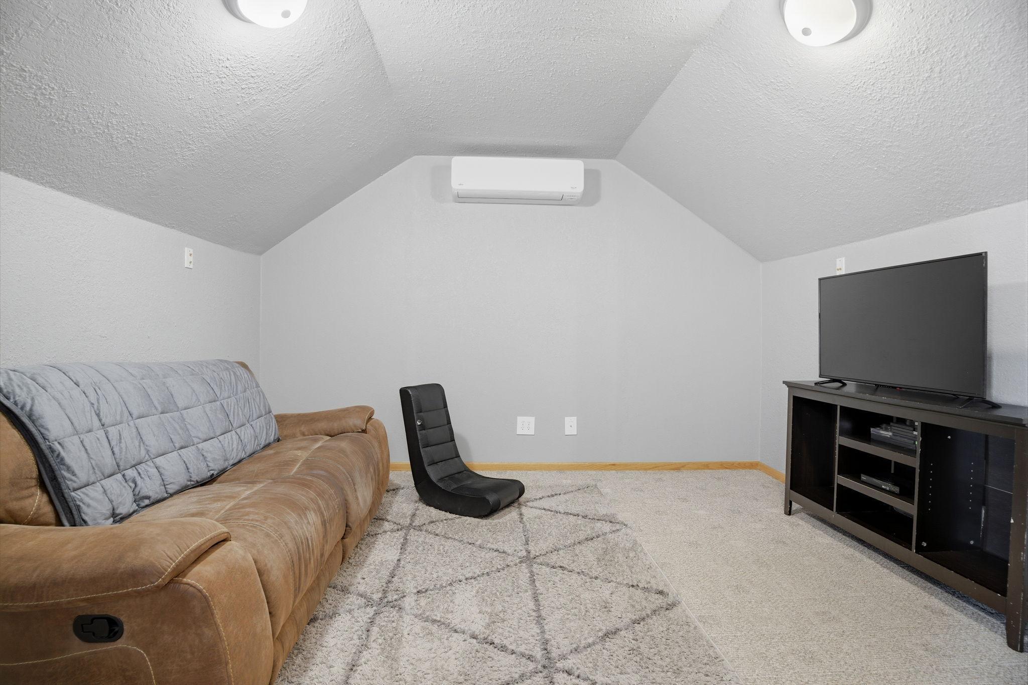 Versatile bonus room ideal for movie nights, complemented by a newly updated heating and air system for consistent year-round comfort.