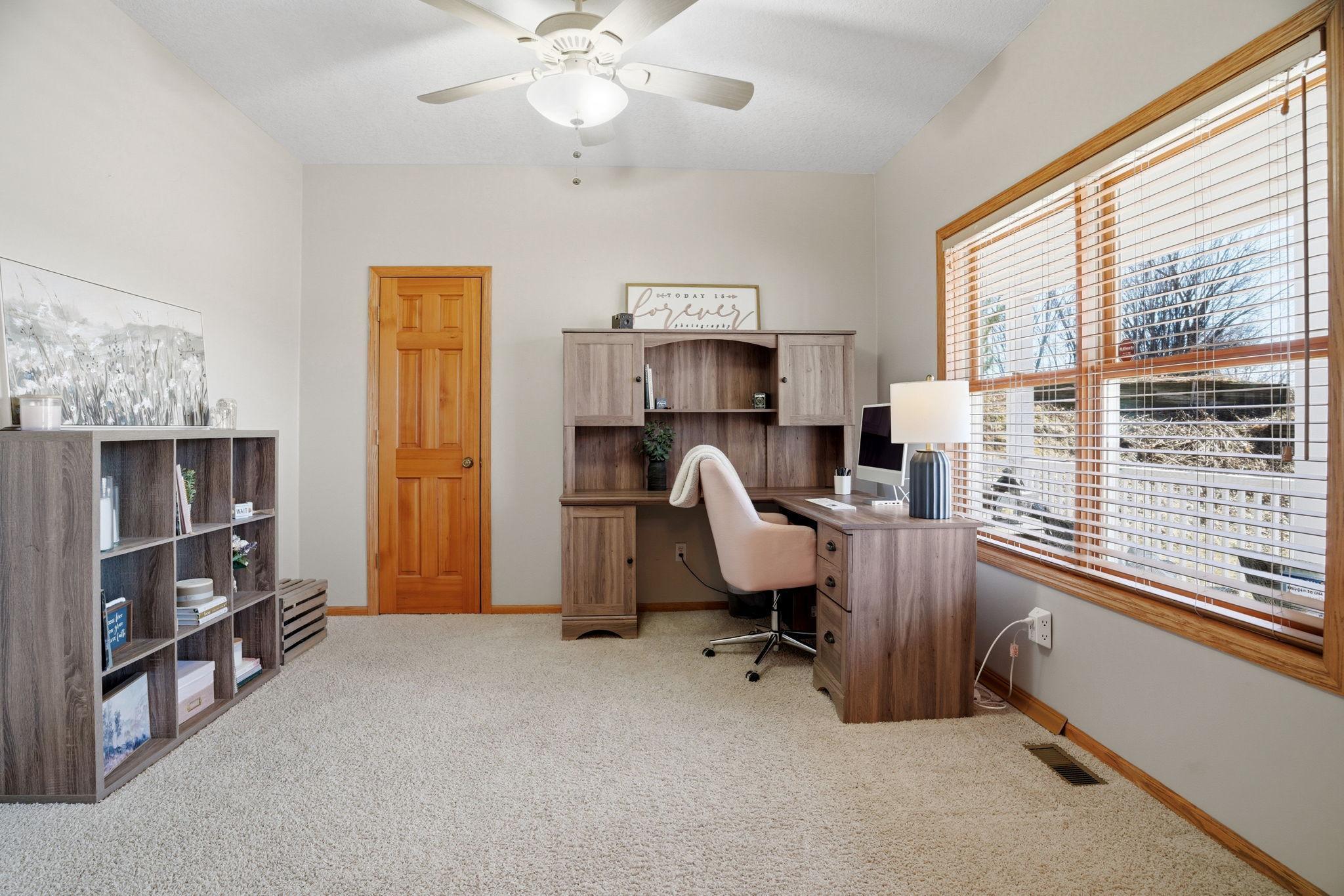 Front office offering lovely cul-de-sac views and a convenient closet for extra storage.