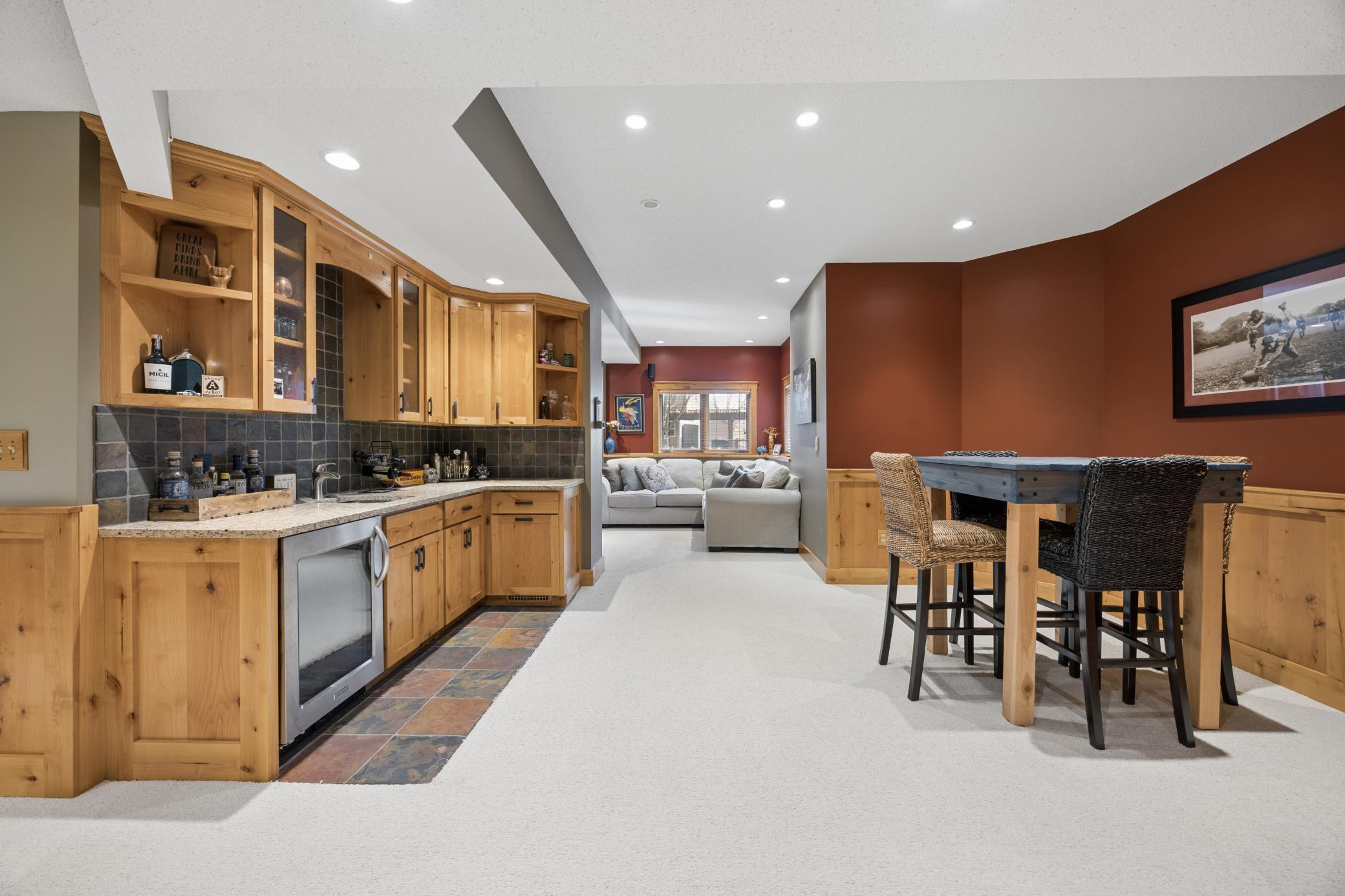 Lower level features 9ft ceilings, open floor plan, and plenty of unfinished storage space as well