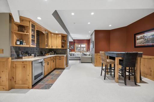 Lower level features 9ft ceilings, open floor plan, and plenty of unfinished storage space as well