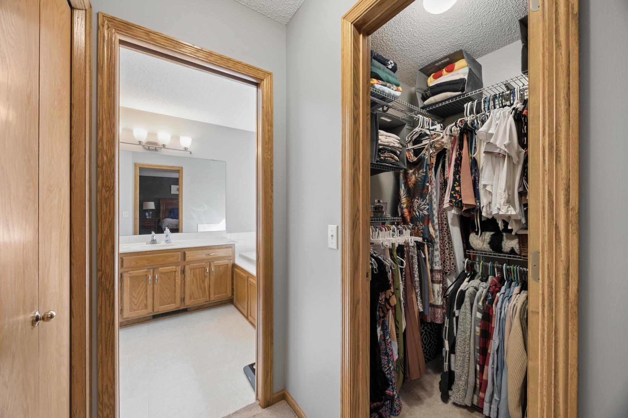 Primary bedroom walk-in closet and private bathroom