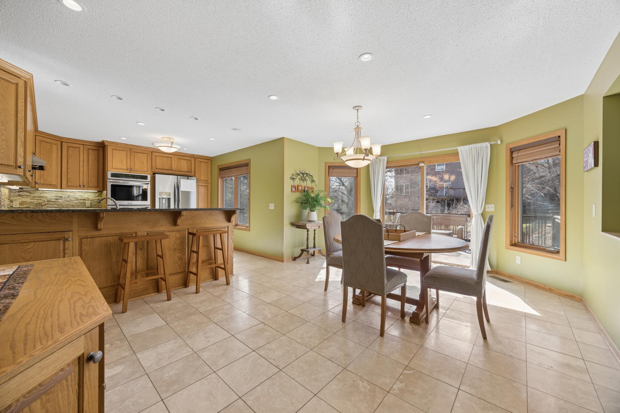 Dining area flows off of the kitchen and easily to the spacious deck, making summer grilling & outdoor gatherings a breeze