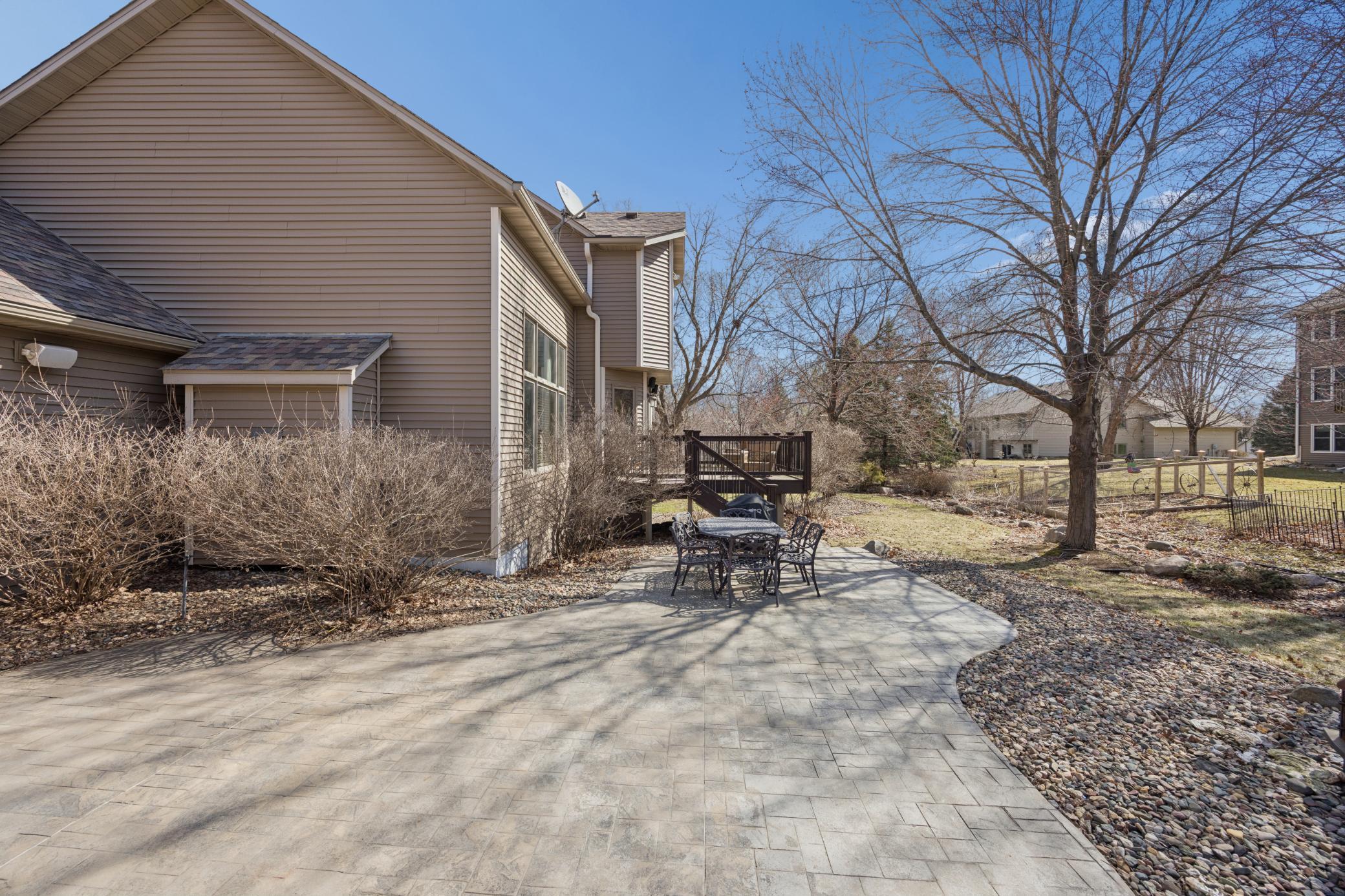 Additional view of paver patio and deck