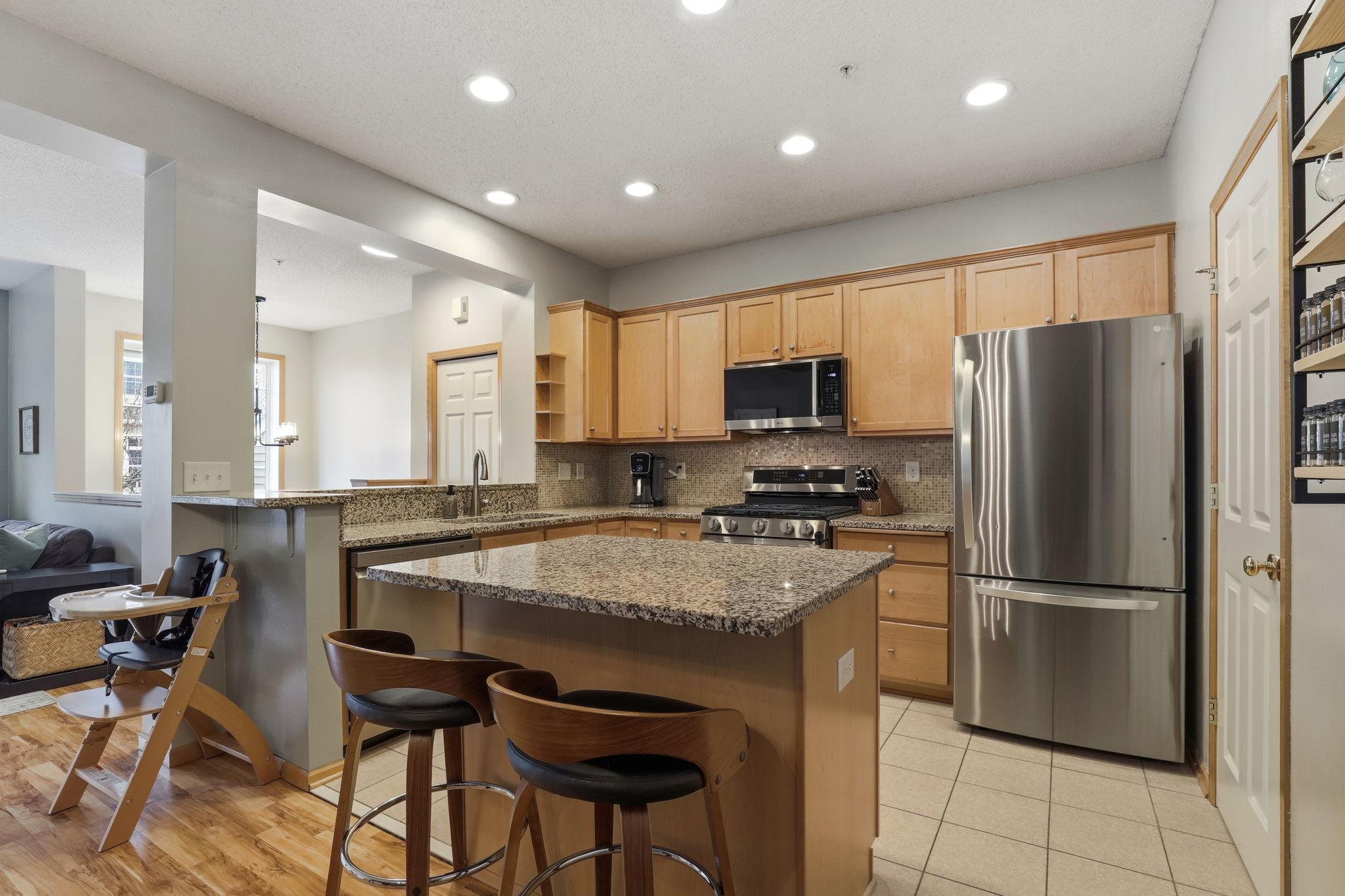 Lovely center island for extra counterspace and breakfast bar