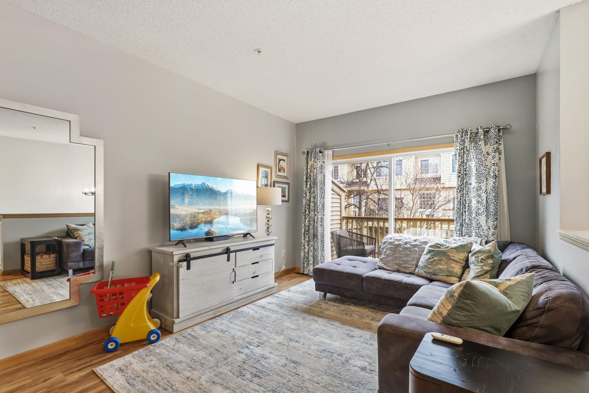 Look at the natural light coming in from the West facing patio door and open floor plan.
