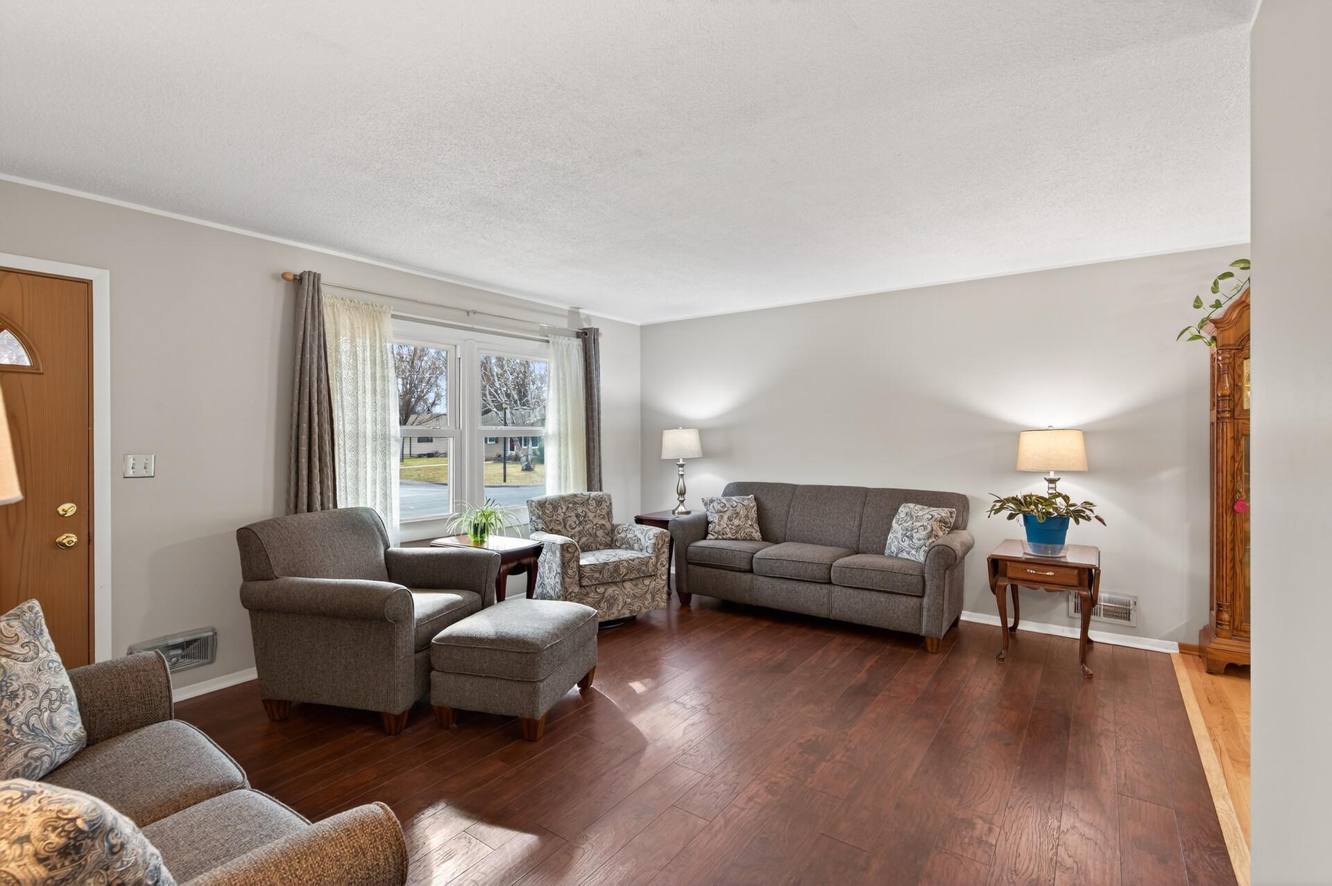 Updated with luxury vinyl flooring in the living room and hallways for a clean, modern feel.