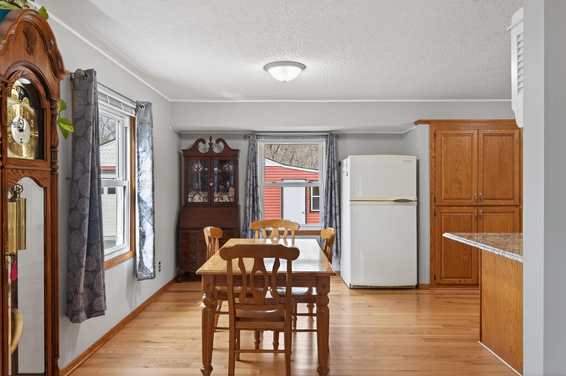 From the dining room, you have views into the kitchen and out to the backyard, making the space feel open and connected.