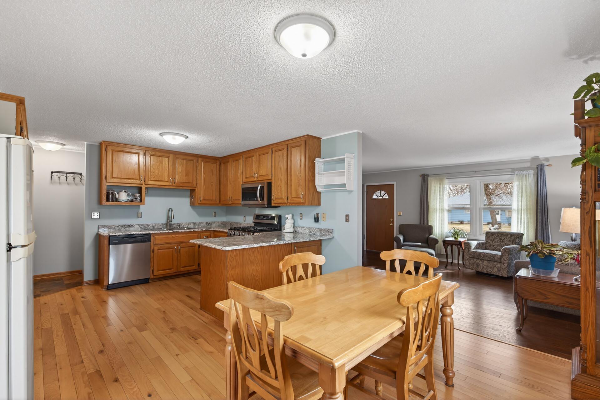 The dining room flows right into the kitchen and opens up to the living room, keeping everything connected.