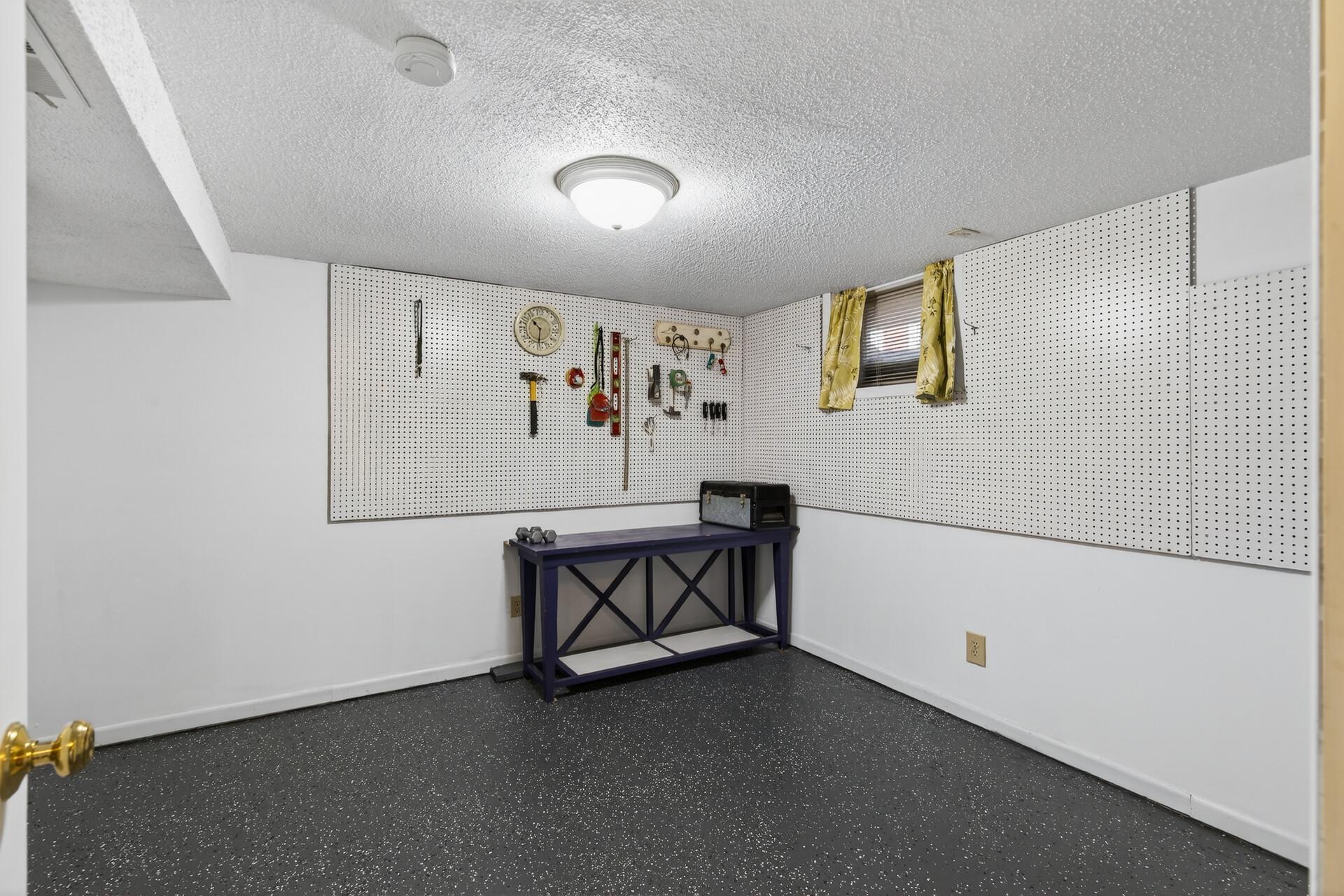 Additional room that could be a 5th bedroom with the installation of an egress window.