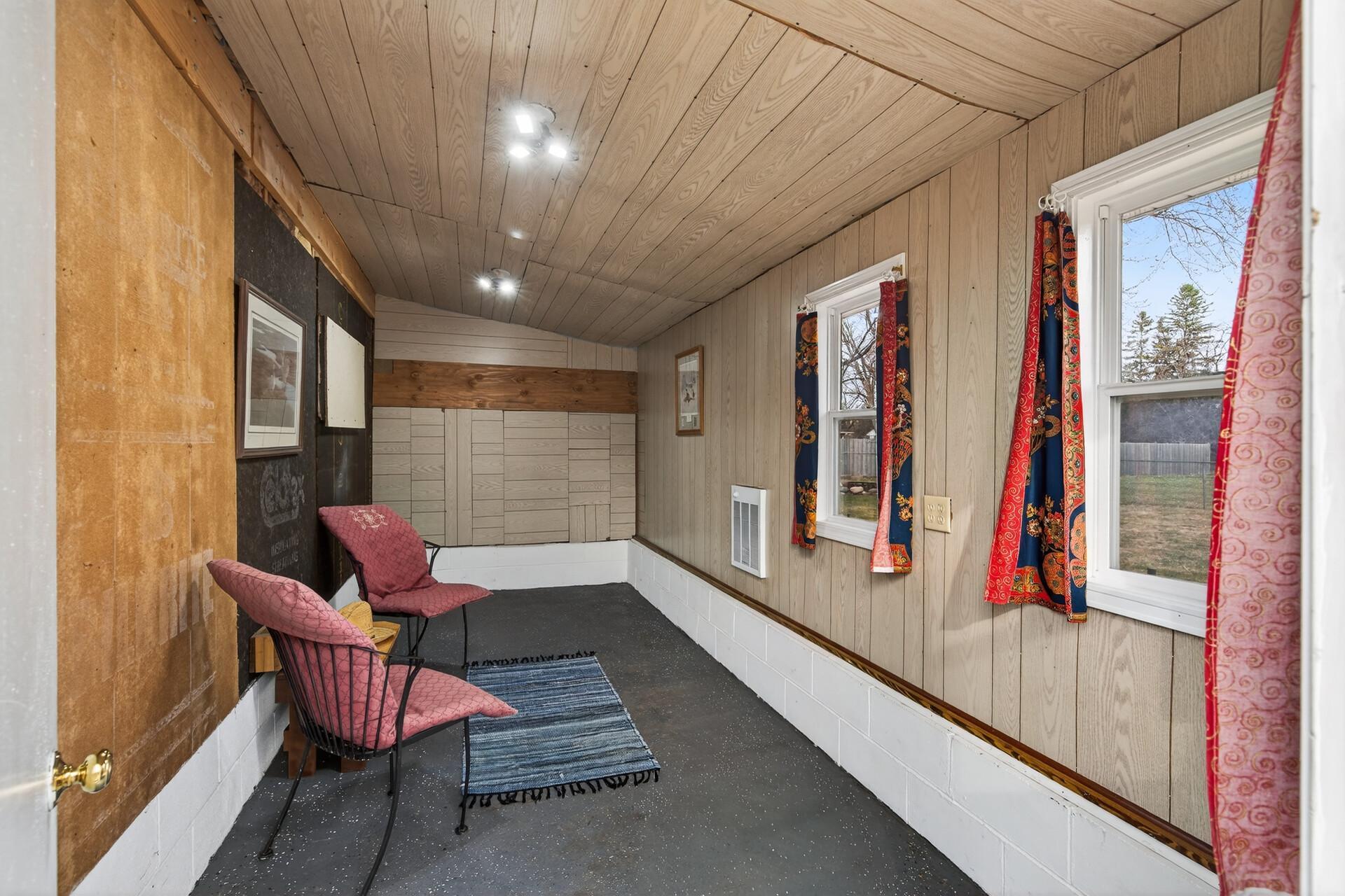 Covered and heated lean-to that works well as a sitting area or added storage space.