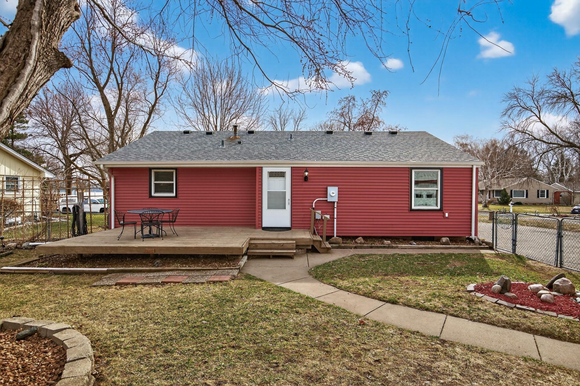 Step out onto the rear deck and take in the view of the backyard.