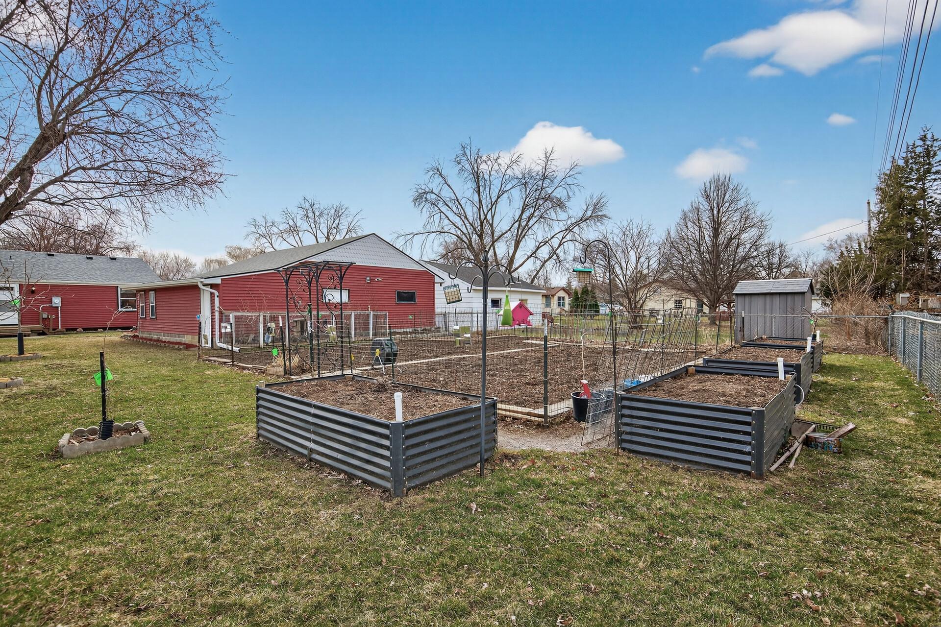Raised garden beds already set up with an internal watering system for easy maintenance.