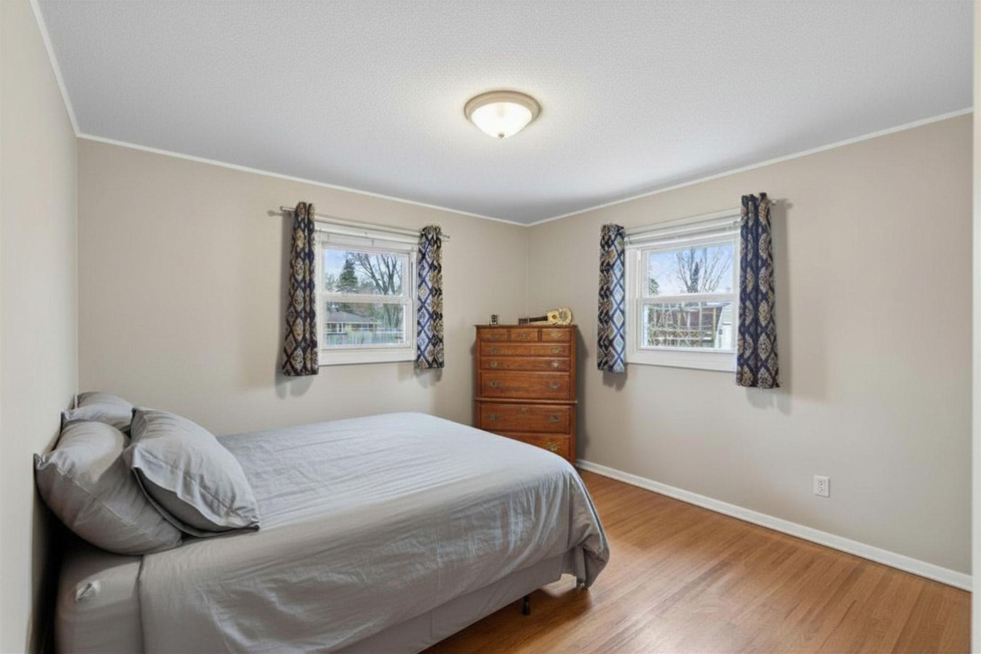 Main floor bedroom #2 with a simple, functional layout.