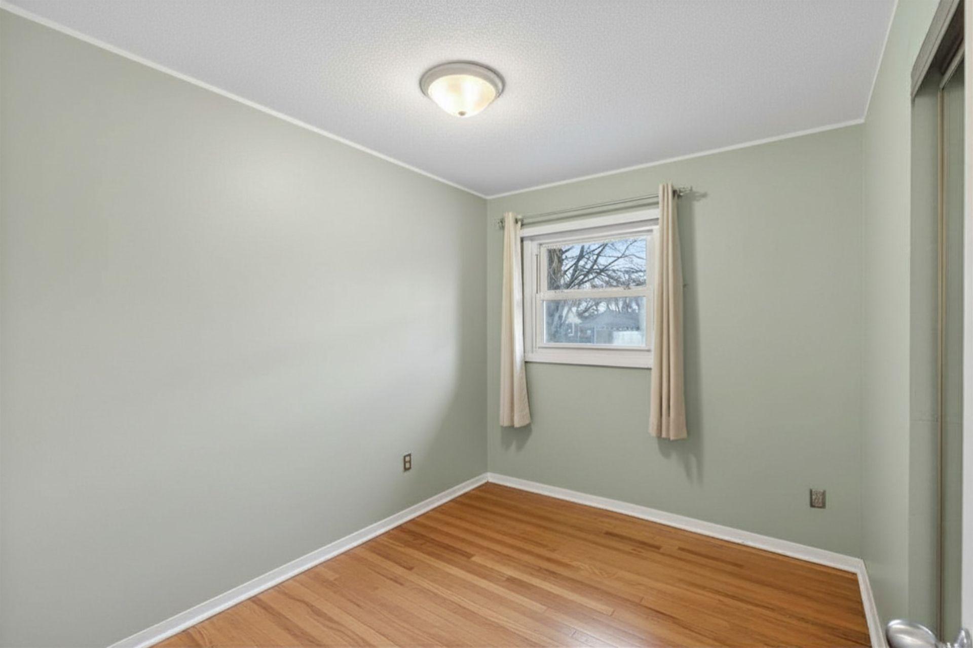 Main floor bedroom #3, currently used as a home office.
