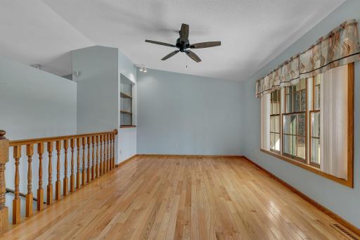 Another view of the living room. built-in bookshelf and large windows