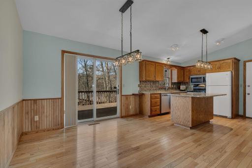 Updated kitchen and dining area. Expansive views of the backyard