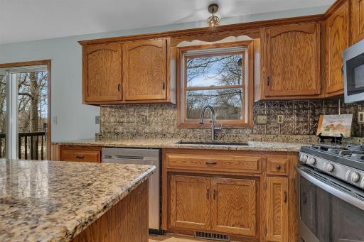 Granite counters and sink window to take in the views of nature