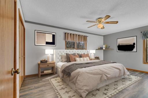 Main floor primary with dual closets - virtually staged