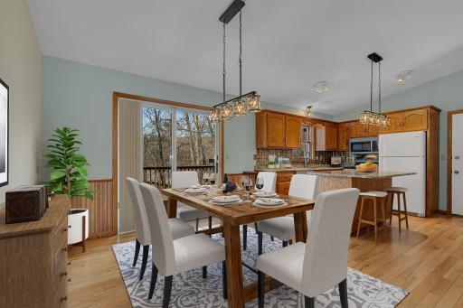 Updated kitchen and dining area. Expansive views of the backyard-virtually staged