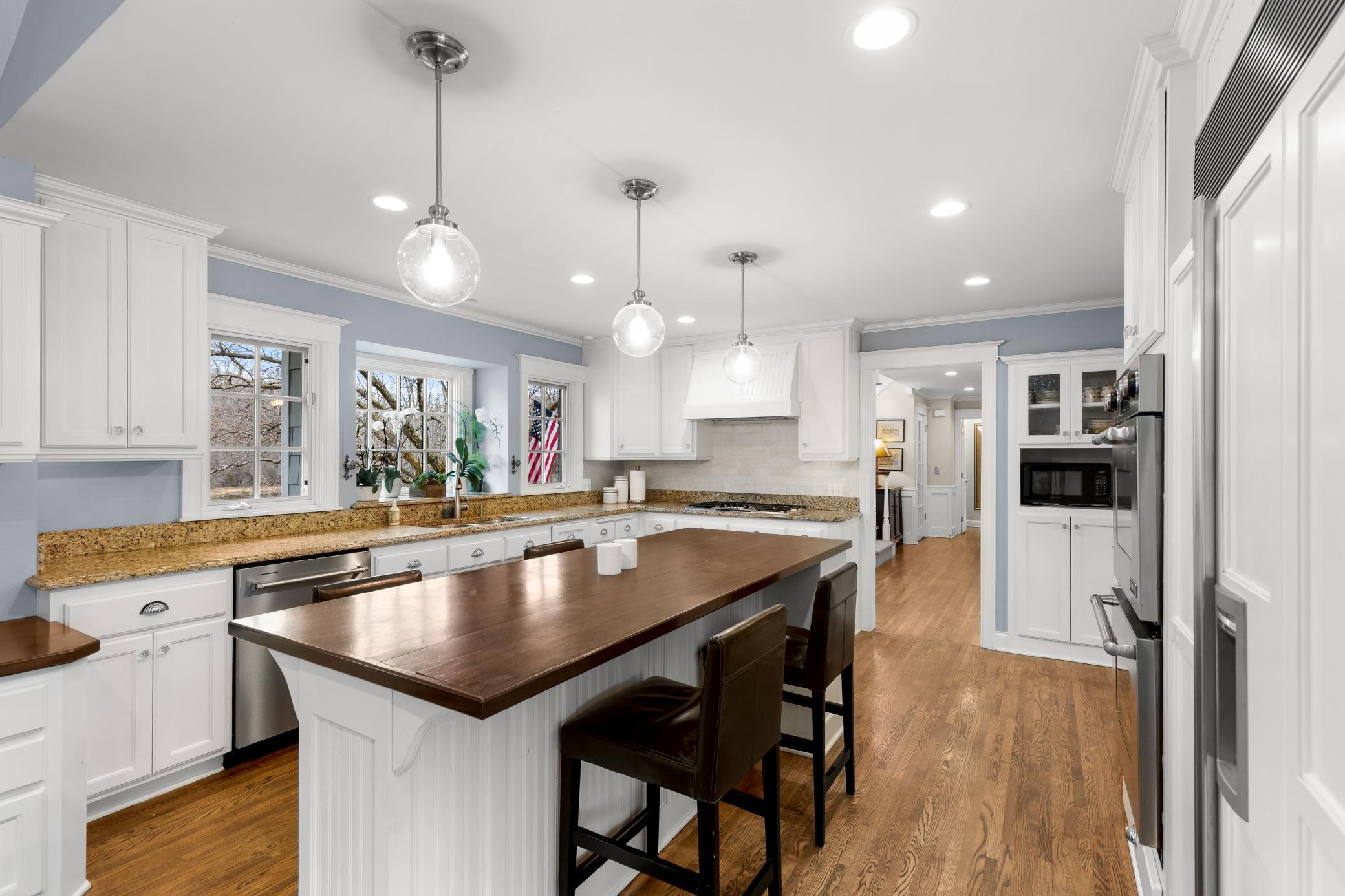 Kitchen with front yard view and access from foyer - contrasting finishes compliment all around