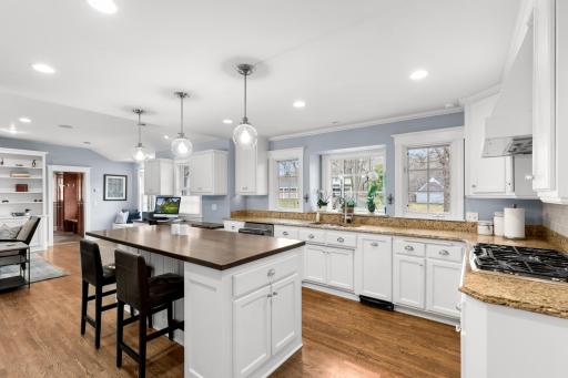 South facing light floods into the bright kitchen complimenting the natural stone and wood finishes