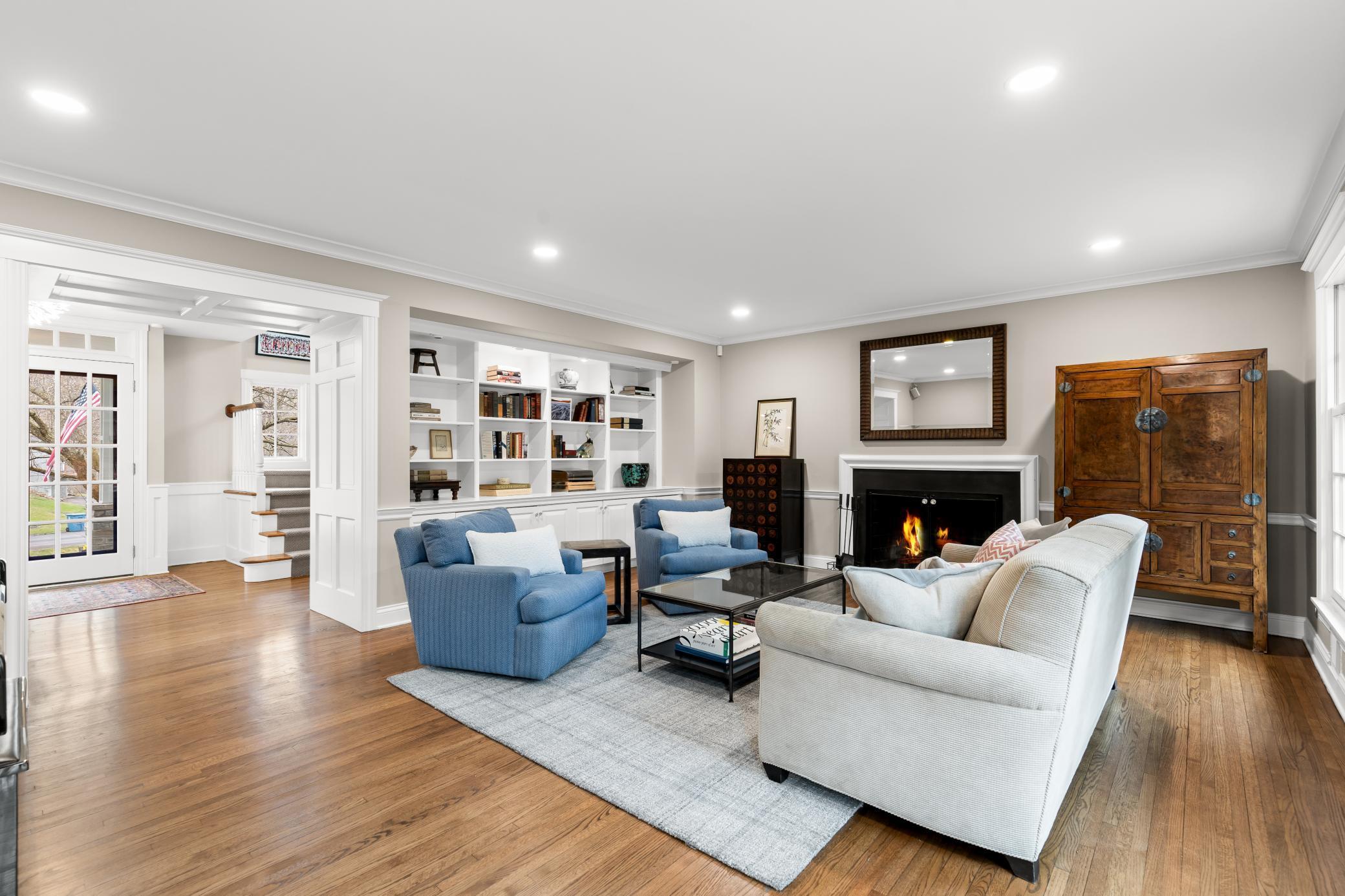 Custom built-ins and wood burning fireplace surround curating a peaceful retreat