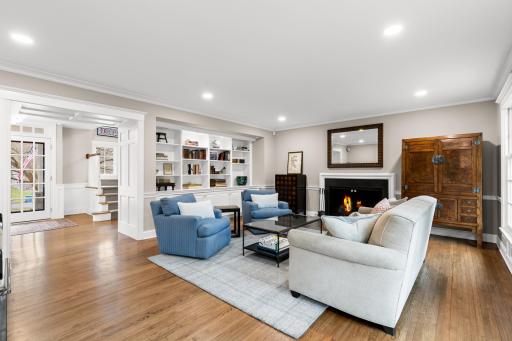 Custom built-ins and wood burning fireplace surround curating a peaceful retreat