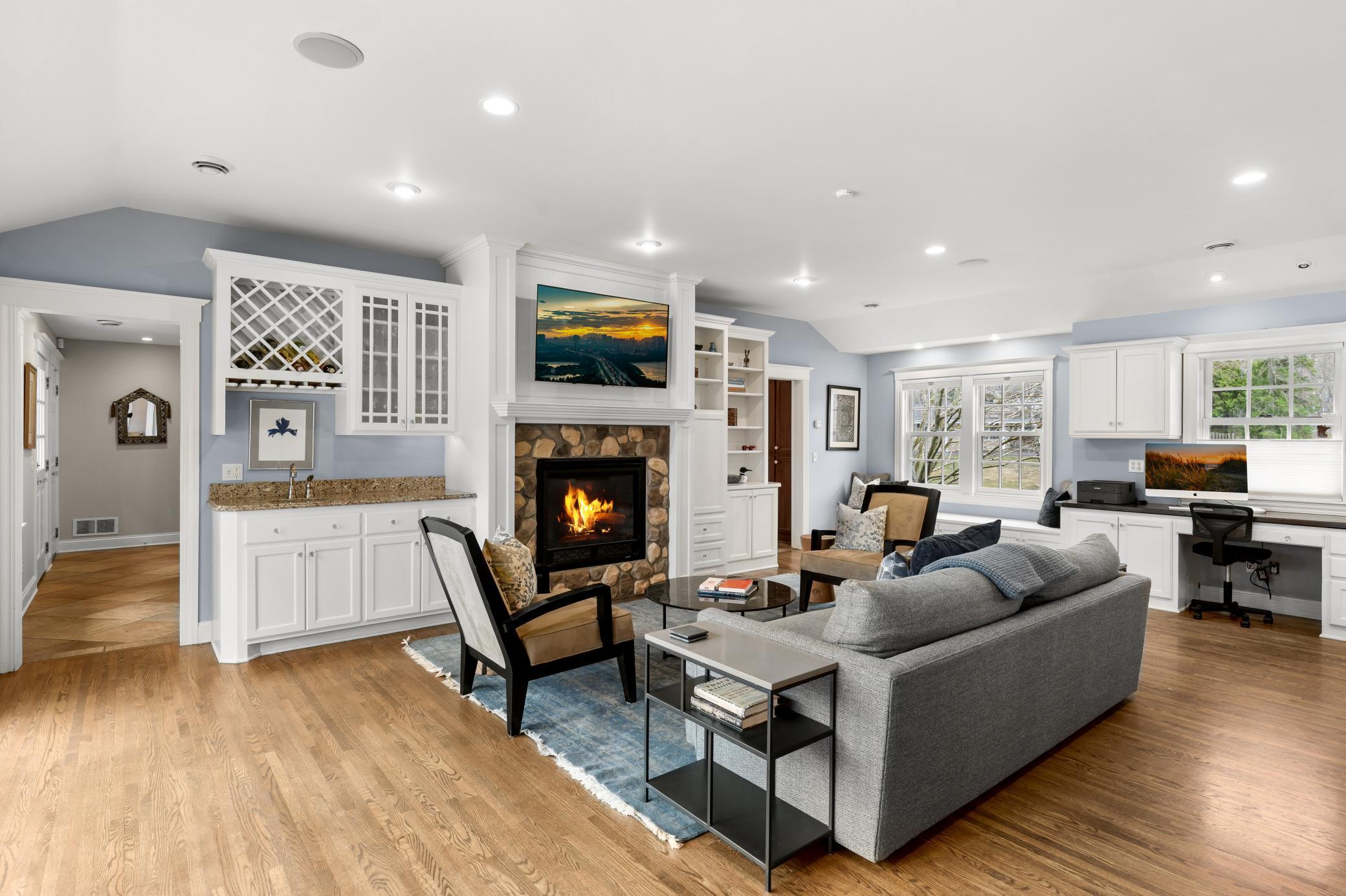 Family room with gas fireplace and built-in wet bar