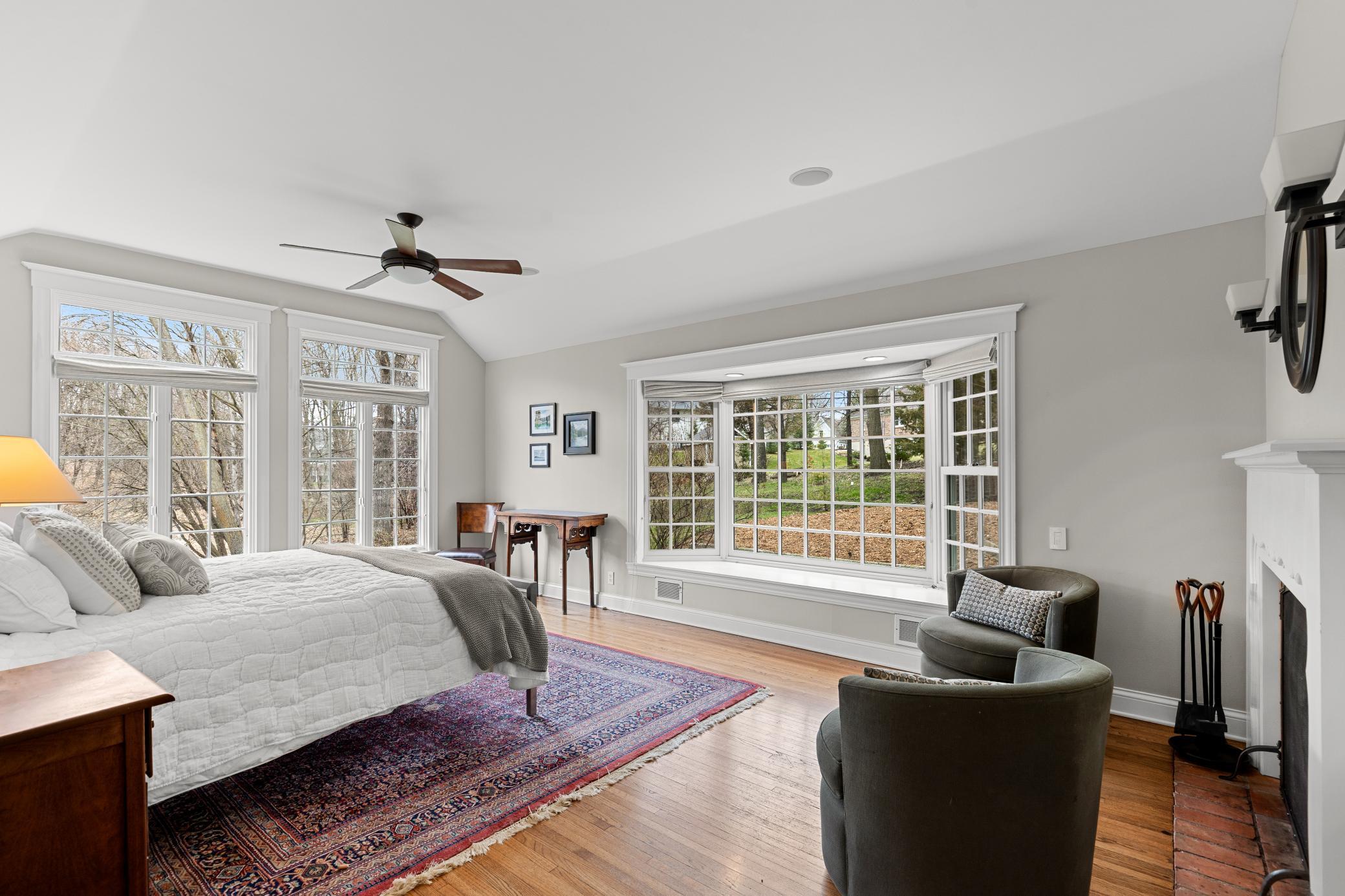 Serene views surround the primary bedroom suite