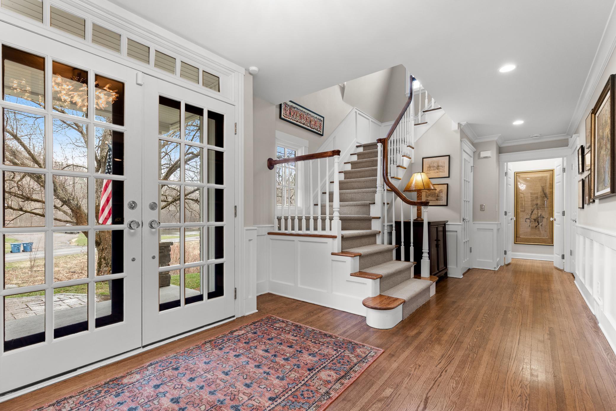 Refined foyer with warm and beautiful hardwood floors