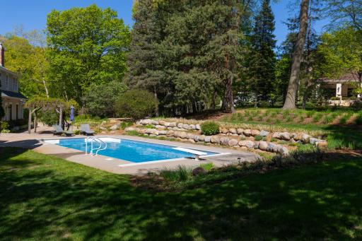The privacy of mature trees, gardens and a salt water pool - all set on 2 acres in Deephaven