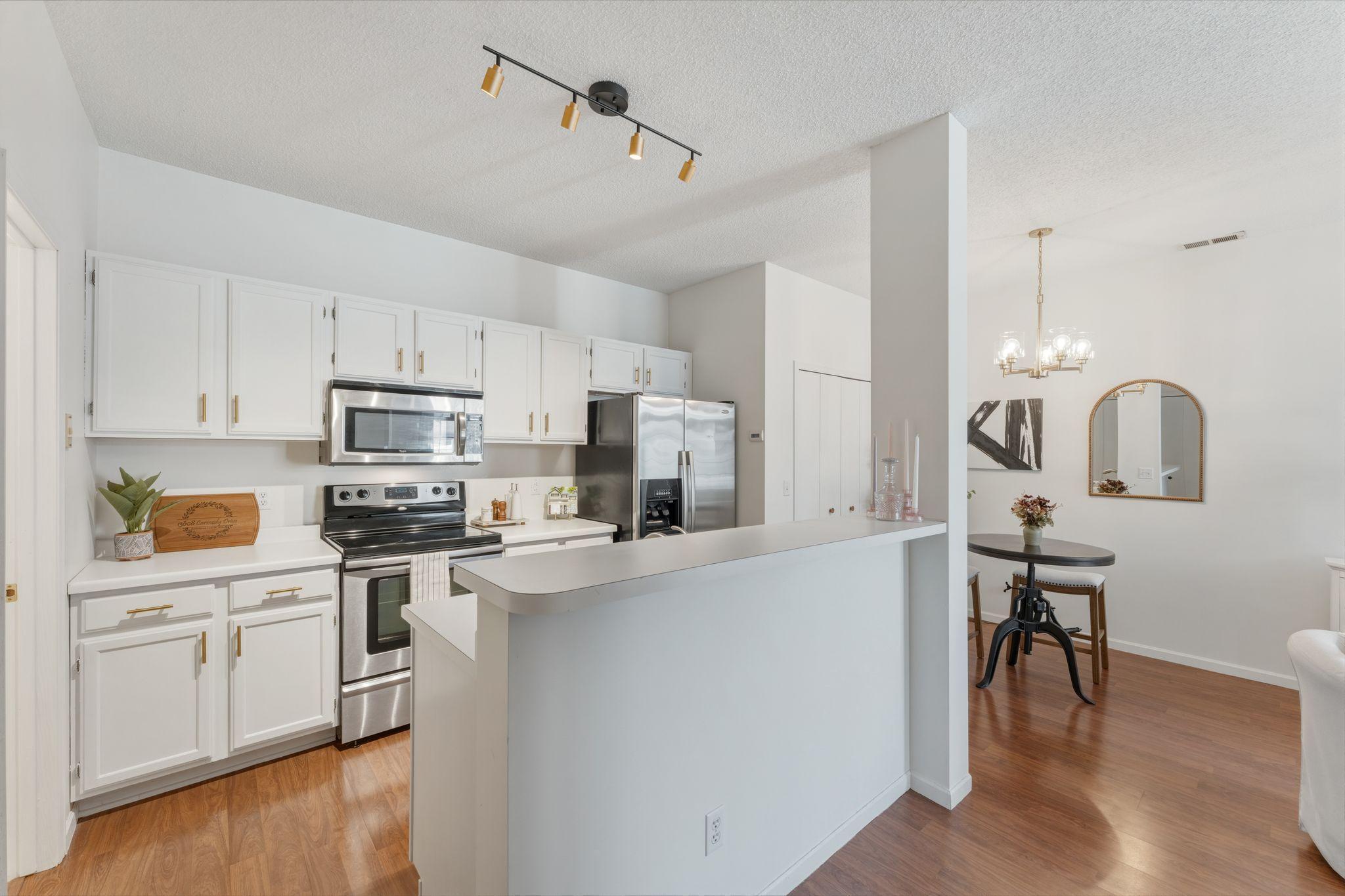 The white cabinets are highlighted with new hardware