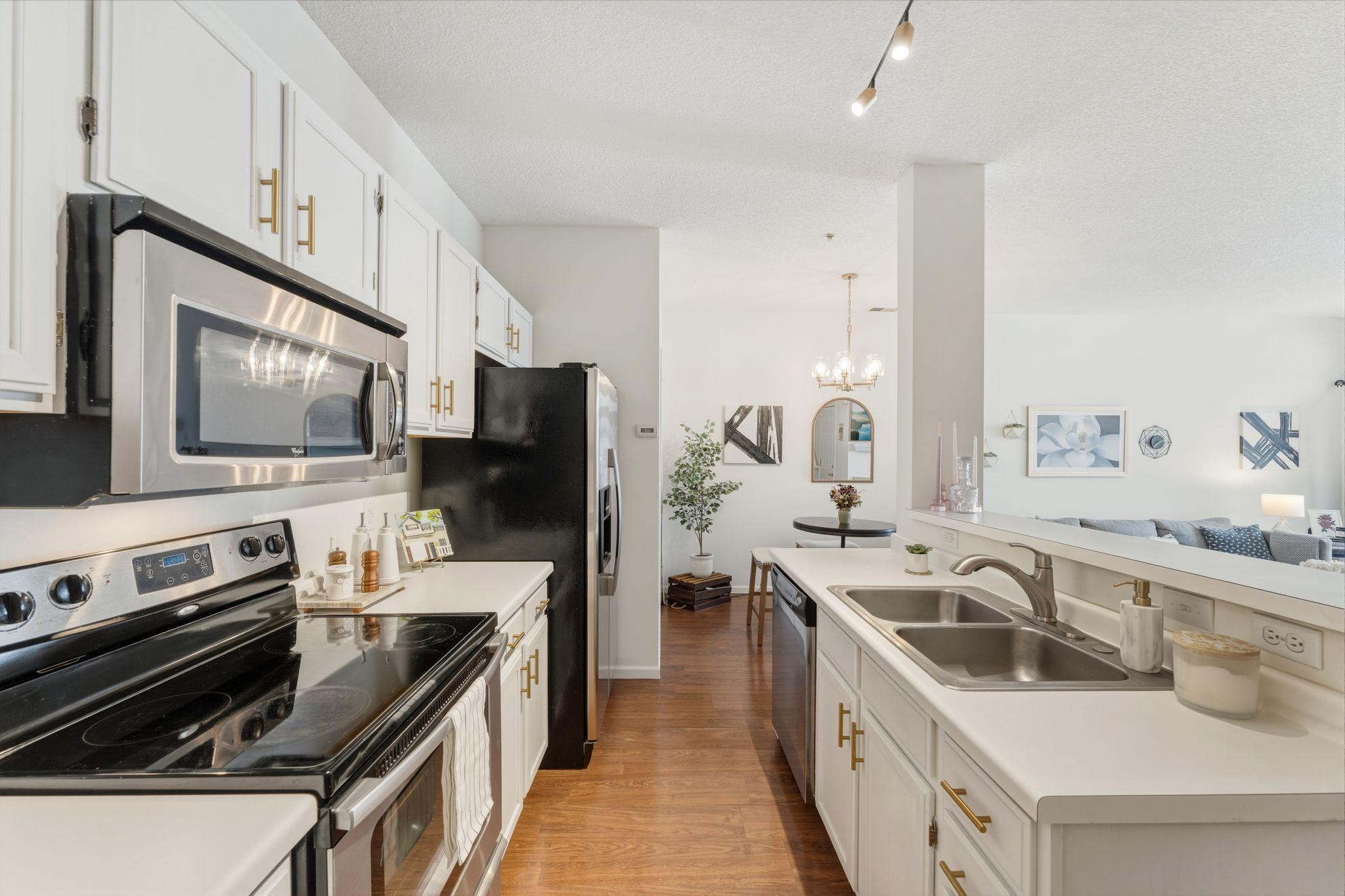 The kitchen features lots of cabinet space.