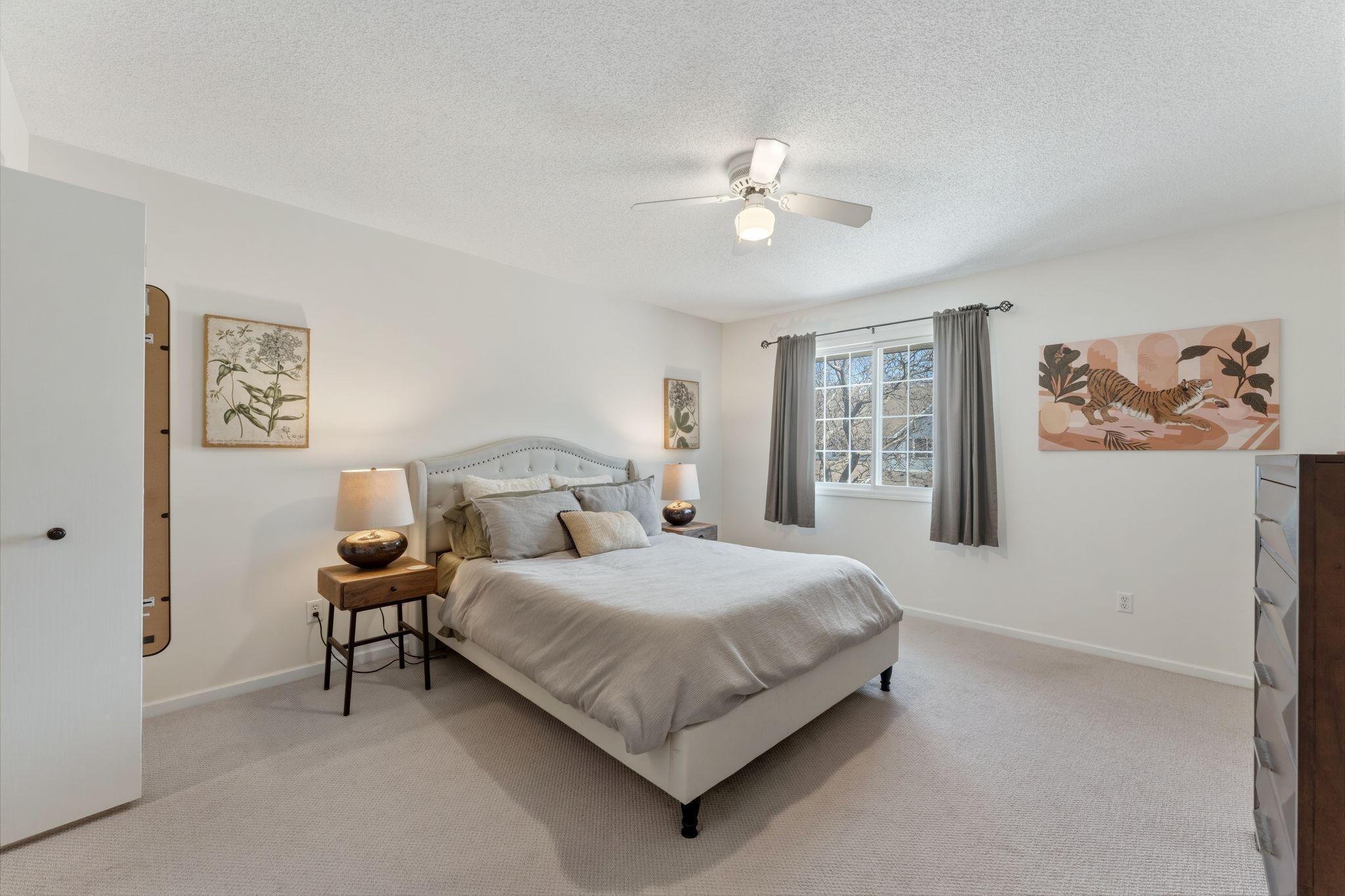 The spacious primary bedroom.