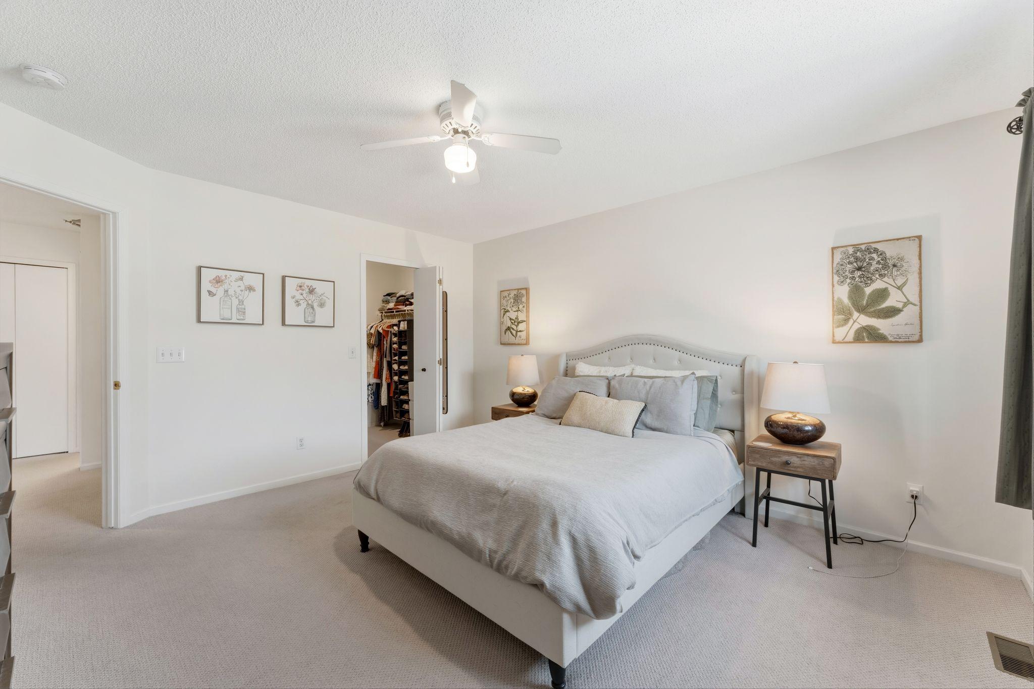 The primary bedroom features a large walk-in closet