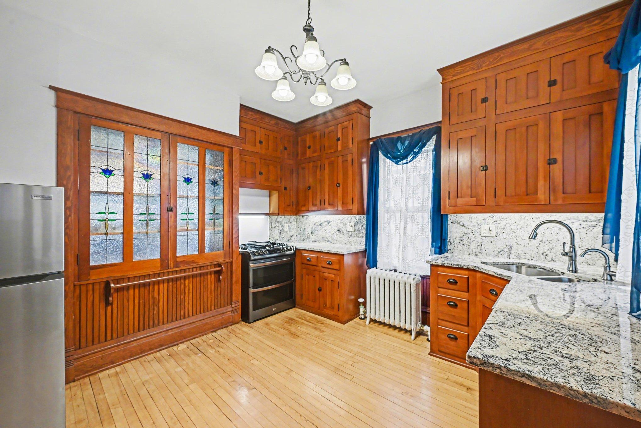 Updated kitchen with granite counter top & stainless appliances