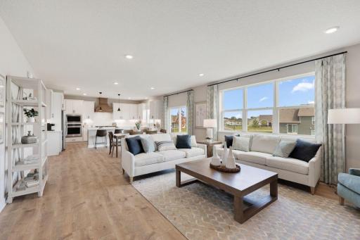 View of your huge main floor from the family room. Photos of model, options may vary.