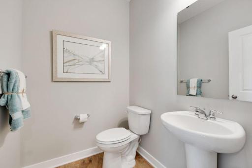 One of two bathrooms located on the main floor. This half bath is perfect for guests. Photos of model, options may vary.