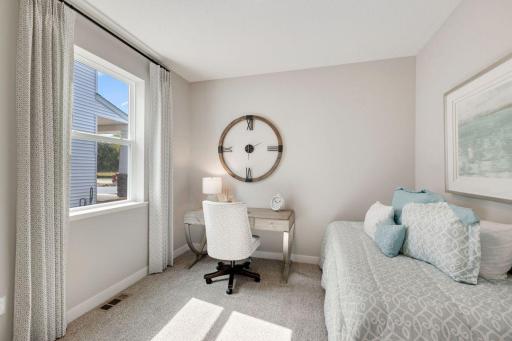 Spacious main floor bedroom is great for guests to have their own space. Photos of model, options may vary.