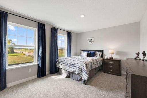 Bedroom 4 located upstairs. Total of 5 bedrooms in this home! Photos of model, options may vary.