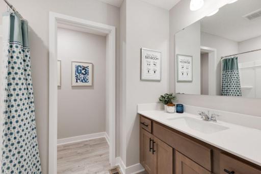 That's right, the third bathroom located upstairs bringing the total number of bathrooms to 5. Photos of model, options may vary.