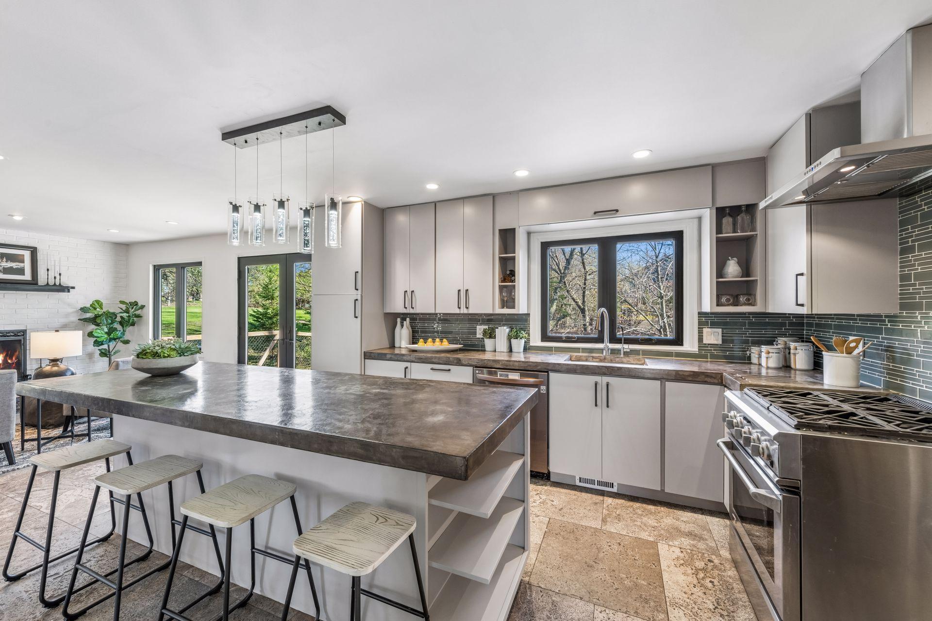Updated kitchen with concrete countertops, new appliances and timeless cabinetry