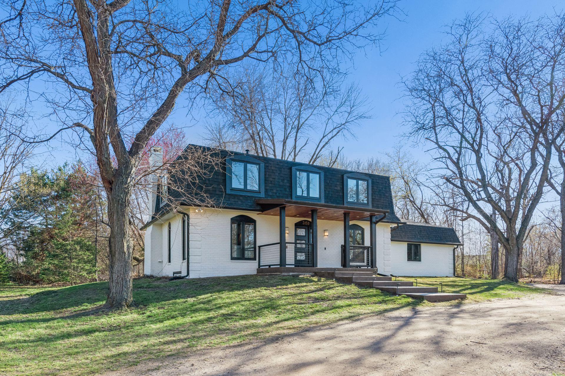 Front porch with seasonal lake views of Lake Minnetonka