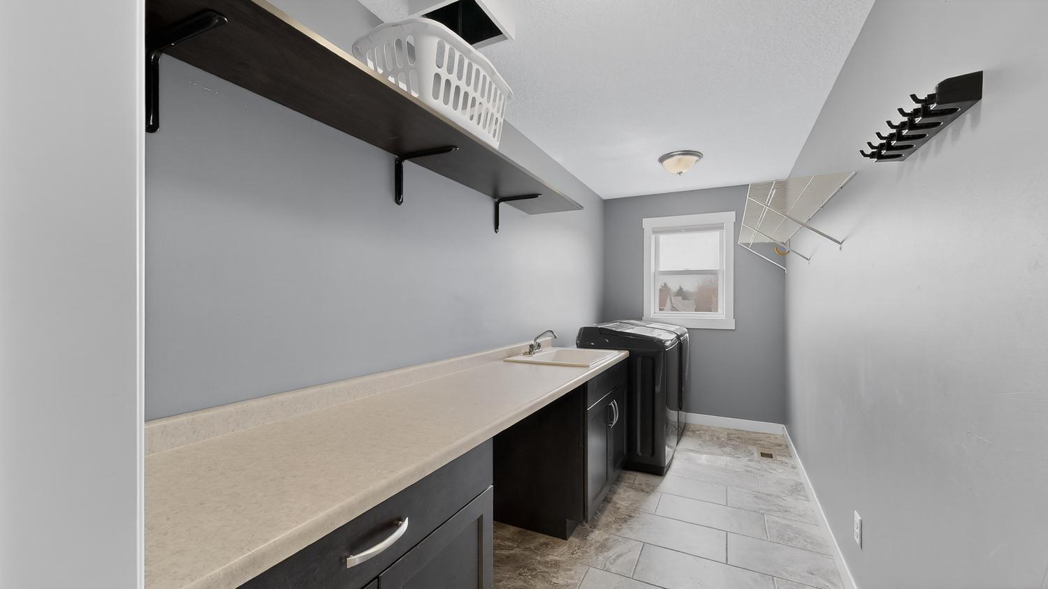24 Laundry Room w:laundry chute, coutner space & cabinets.jpg