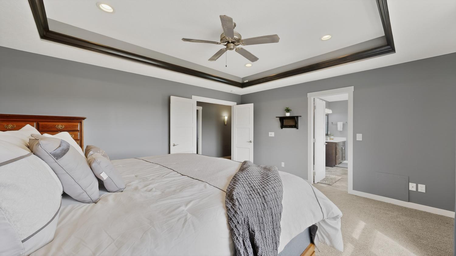 26 Primary Suite w:recessed lighting and ceiling fan.jpg