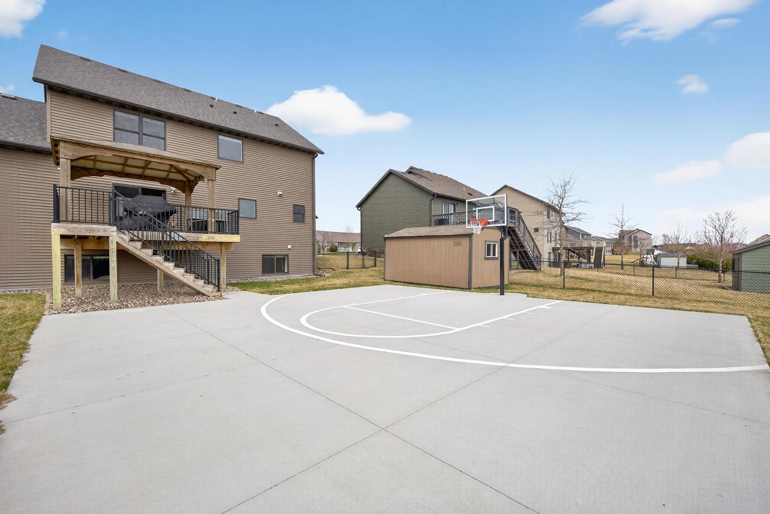 58 View of back of home, shed & basketball court.jpg