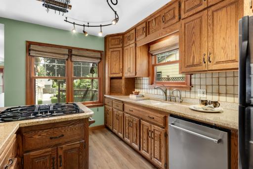 many cupboards and large windows overlooking deck