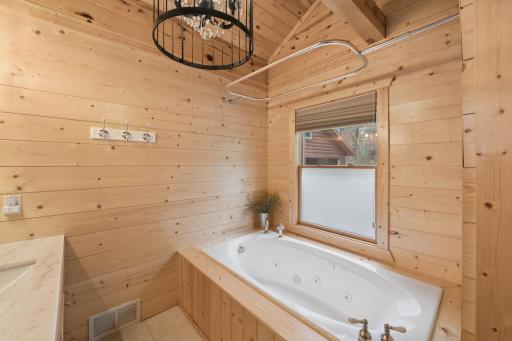 Jetted tub as part of the primary suite.