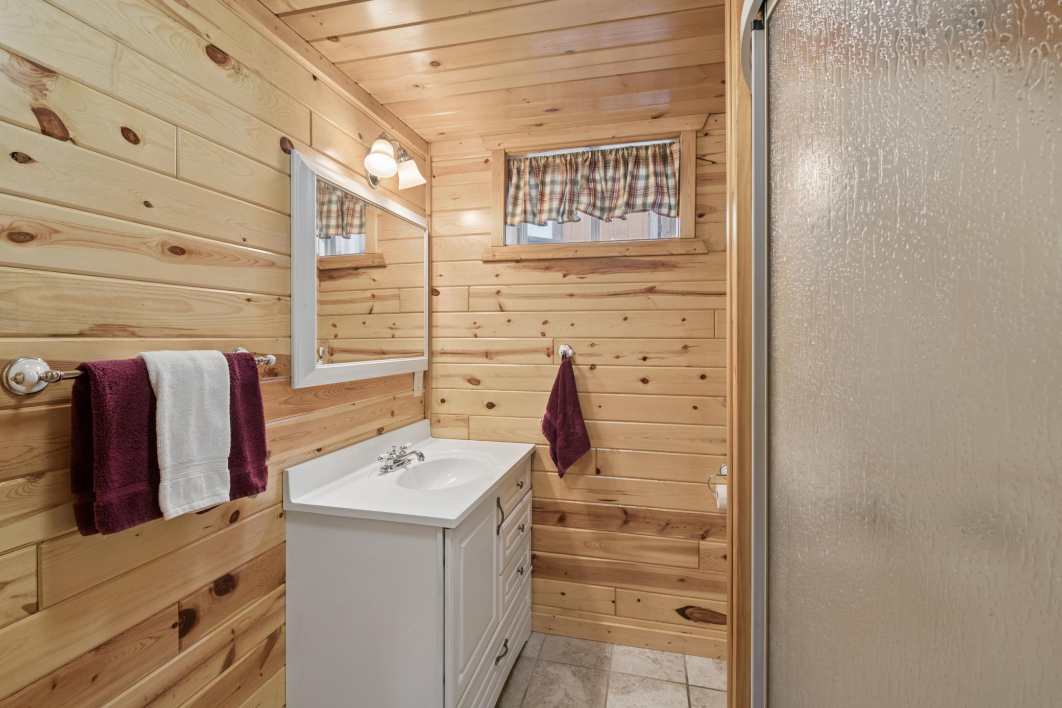Bathroom tucked on the lower level for shower / use.